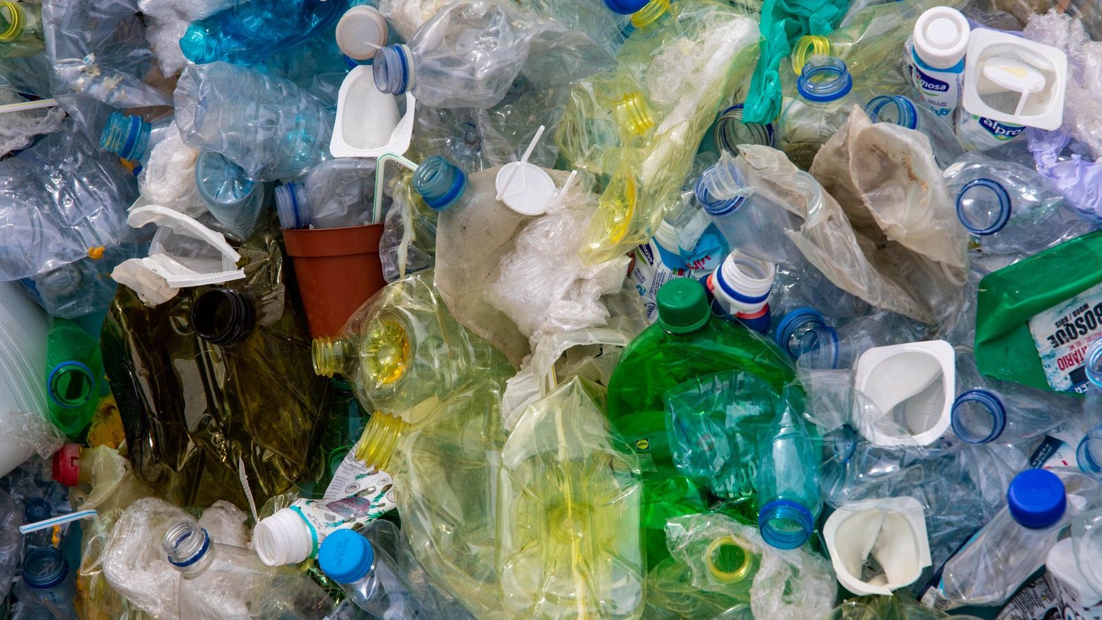 Pile of discarded plastic bottles and packaging